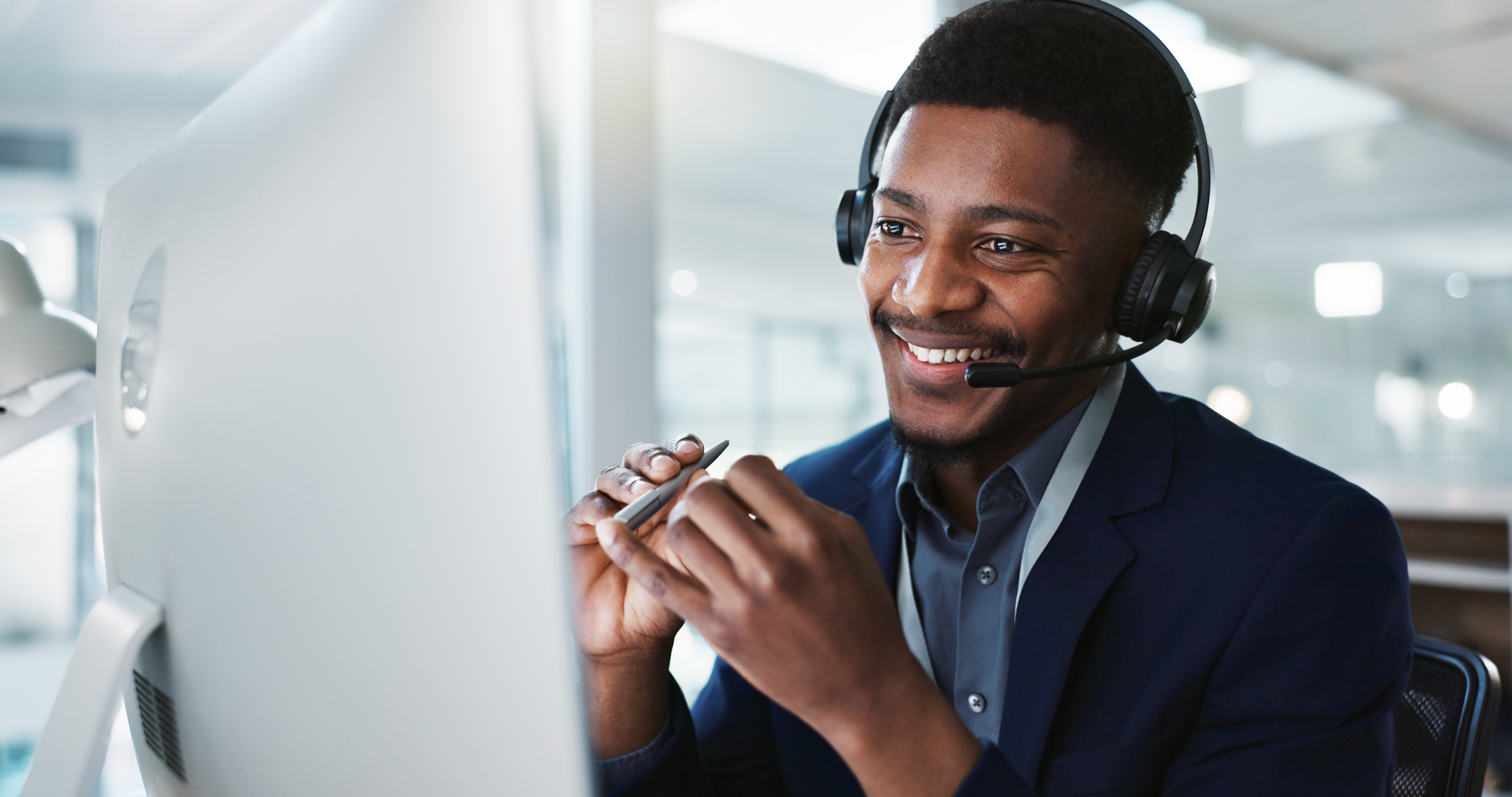 Customer service agent with headset speaks with customer