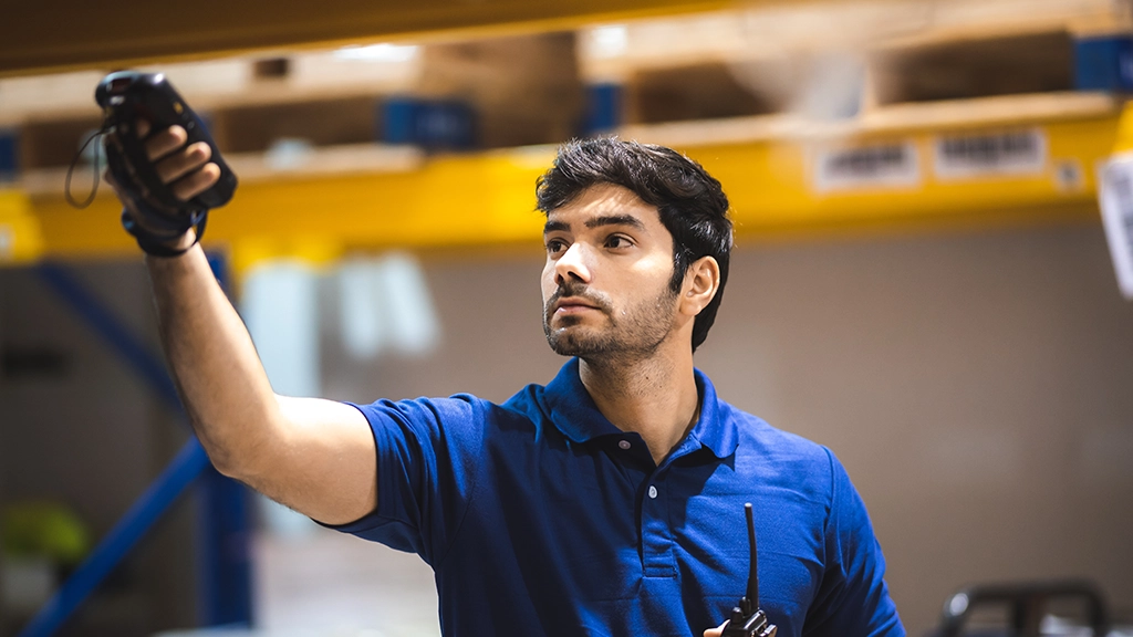 Warehouse worker scanning inventory with barcode scanner