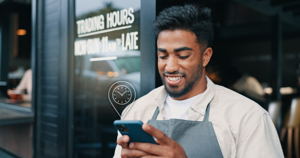Restaurateur waits for foodservice delivery viewing ETA on mobile device 