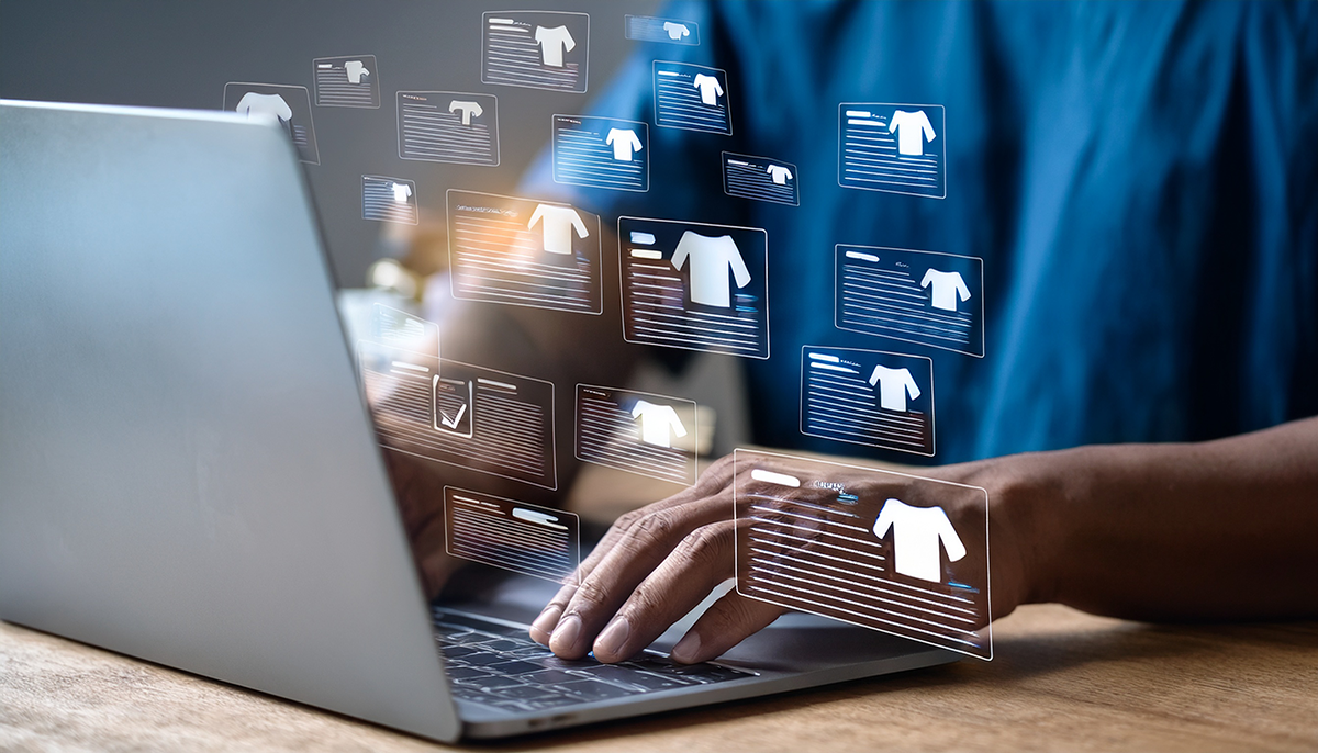 A person is typing on a laptop, using Product Information Management (PIM) software to manage multichannel ecommerce product listings, represented as multiple cards with a t-shirt icon and lines representing text.