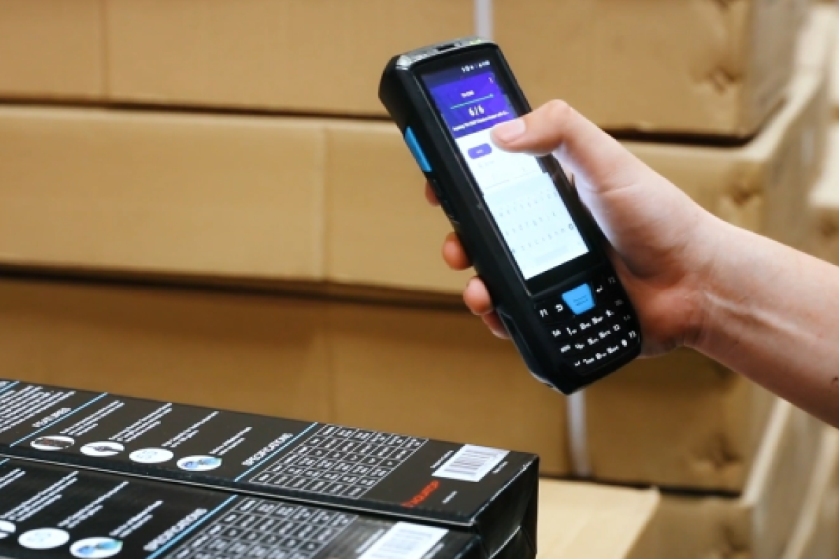 Warehouse worker using a mobile WMS with order rules and scheduled tasks to retrieve an item on a warehouse shelf