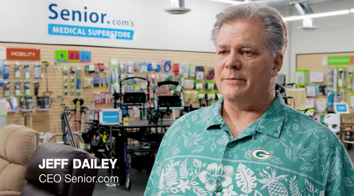 Jeff Dailey, CEO, Senior.com stands in a showroom full of products