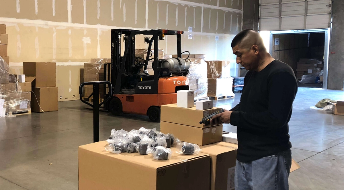 Bapmic Auto Parts Inc. warehouse worker prepares an order for fulfillment