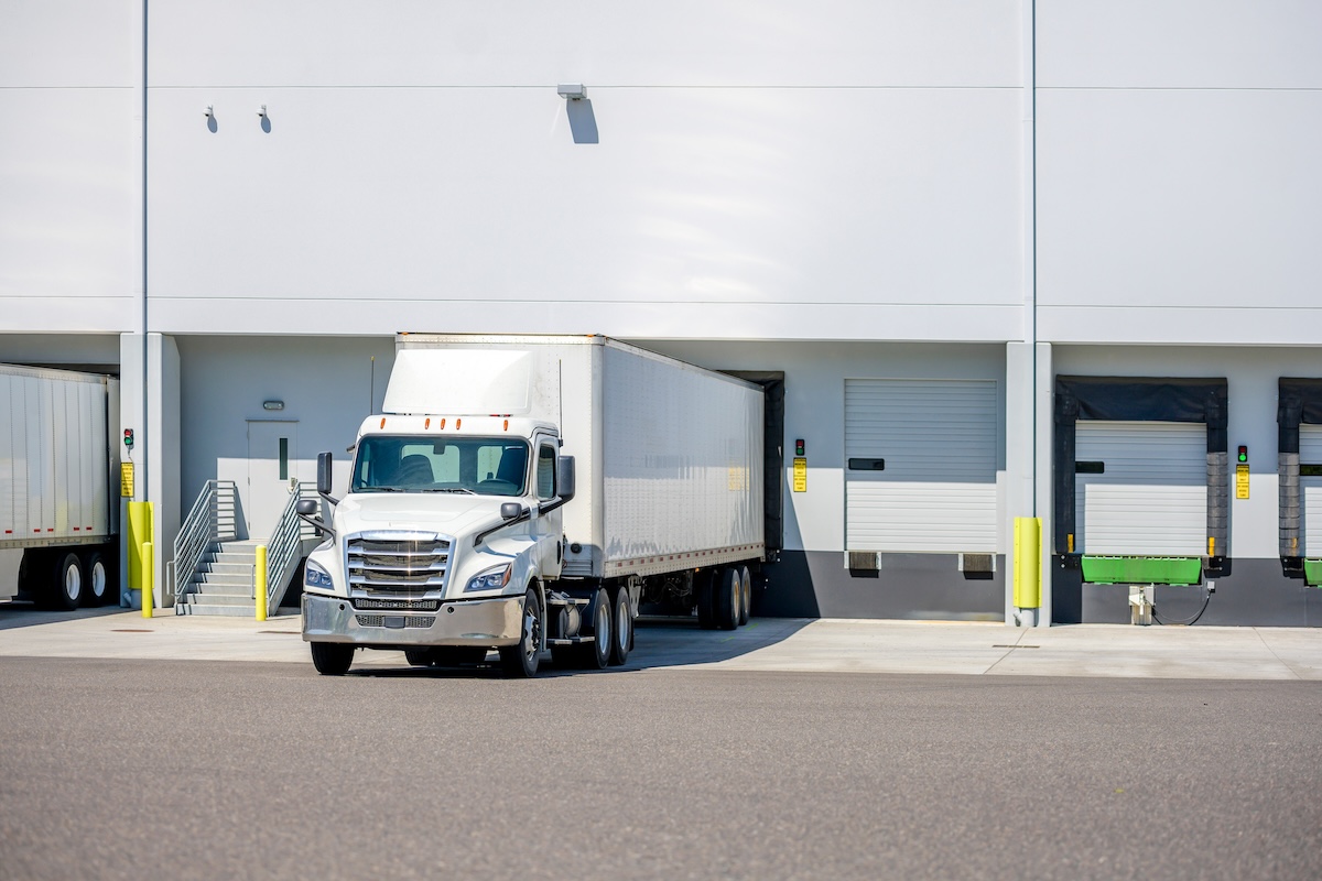 Straight truck for food distribution waits at depot
