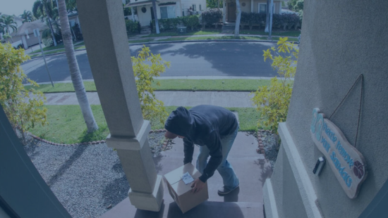 Person stealing a parcel off of a porch