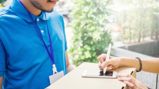 home delivery courier receiving signature on digital proof of delivery