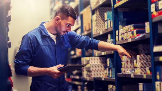 Auto parts worker looks at products