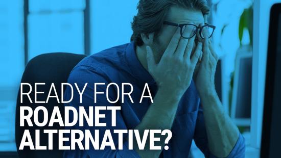 Frustrated man at desk seeking a Roadnet alternative