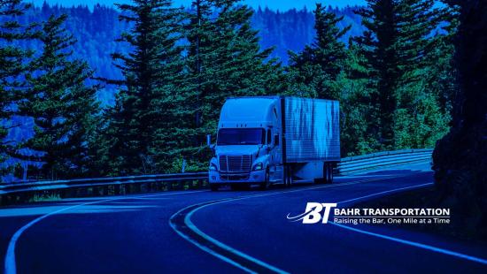Image of a transport truck on a curved road featuring the Bahr Transportation logo