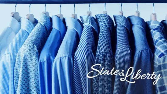 Image of suit jackets hanging on a rack. The State and Liberty company logo is overlayed.
