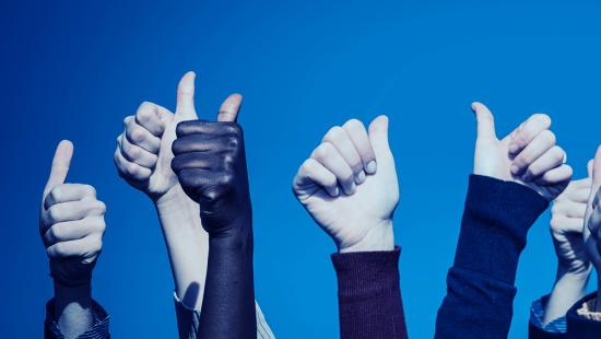 Thumbs up from multiple people, multiple races