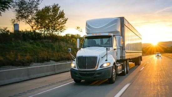 Image of a North American style truck driving down the road