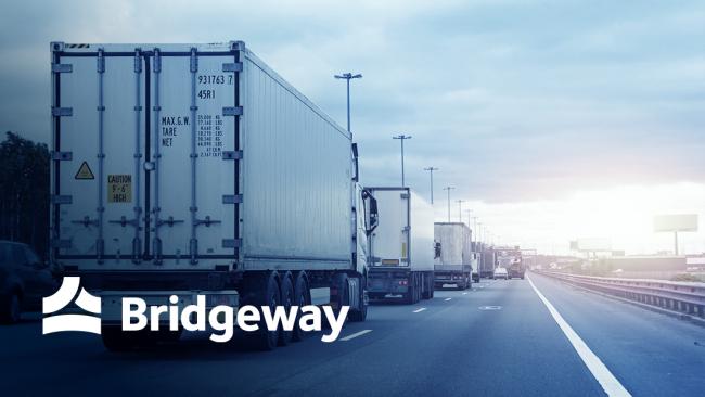 image of a transport truck on the highway. The Bridgeway logo is overlayed in the bottom left corner.