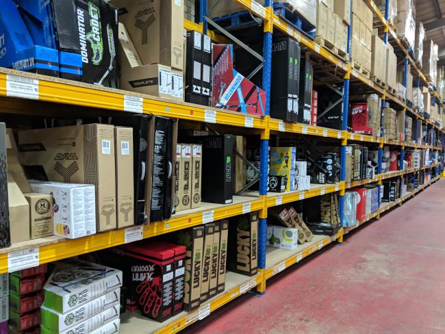 An image showing a well-stocked warehouse rack with neatly organized products.
