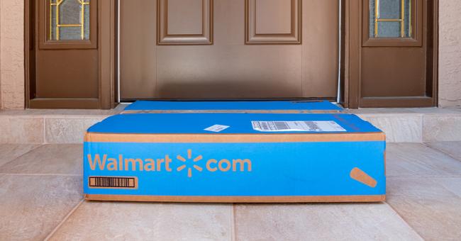 Walmart-branded package placed at the front door of a residential home.